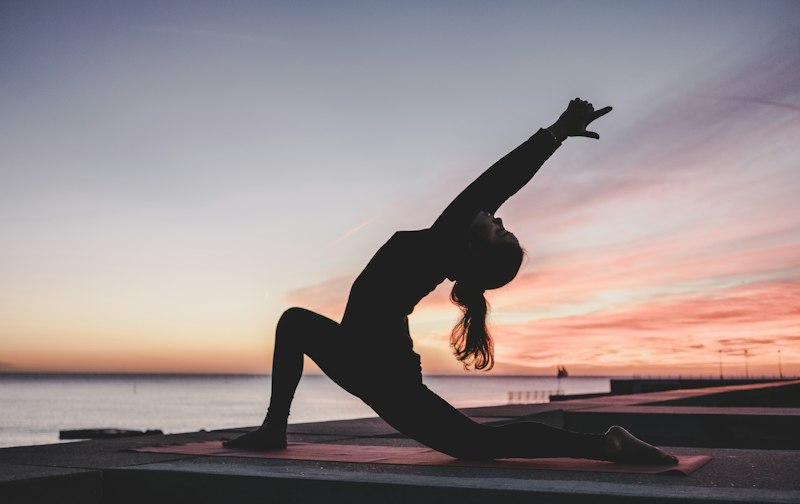 Person practicing yoga for flexibility